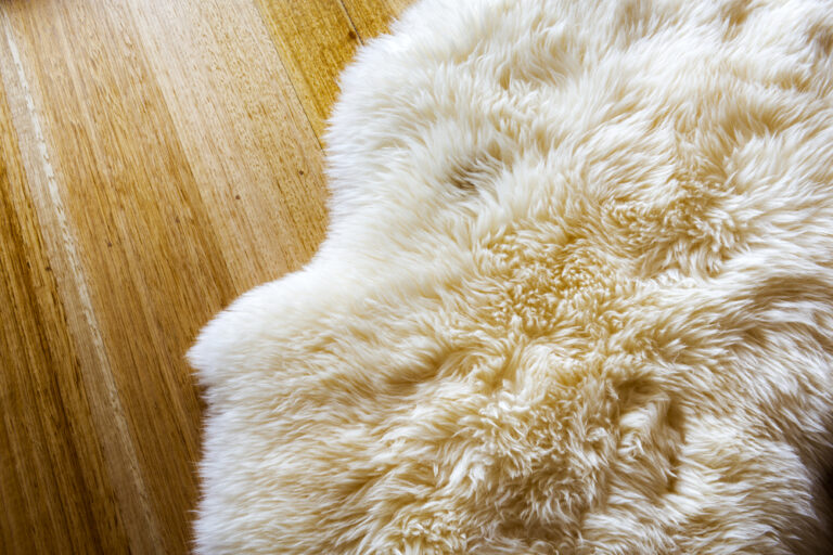 Lambs,Wool,Sheepskin,On,A,Timber,Floor