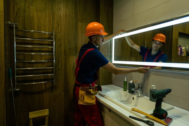 Male,Repairman,Hangs,The,Modern,Electronic,Bathroom,Mirror
